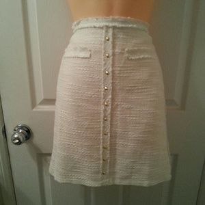 White pencil skirt with gold buttons