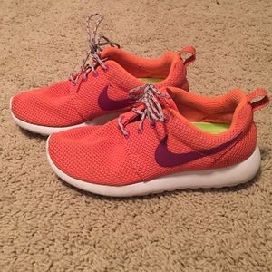 Orange and purple Nike Roshe