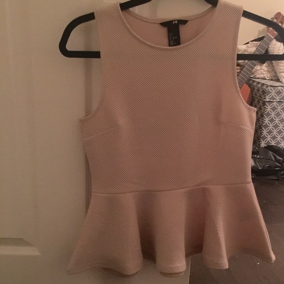 Nude pink structured peplum top