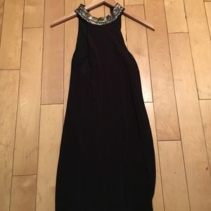 Tight fit black dress fits 2-6 size.