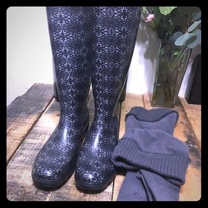 Grey and black rain boots