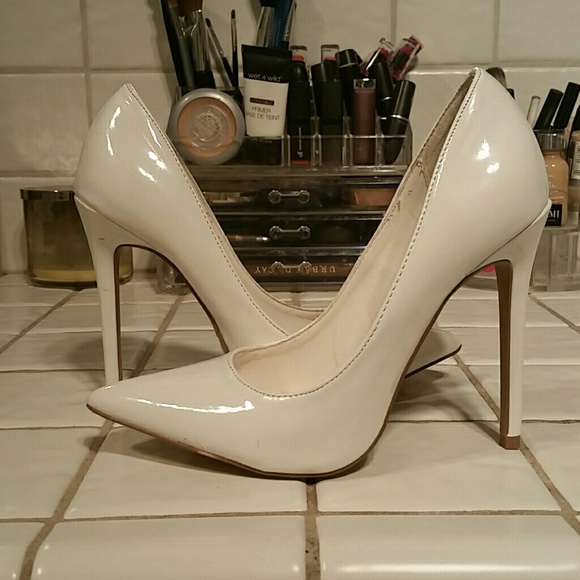 White beautiful pointy heel pumps.