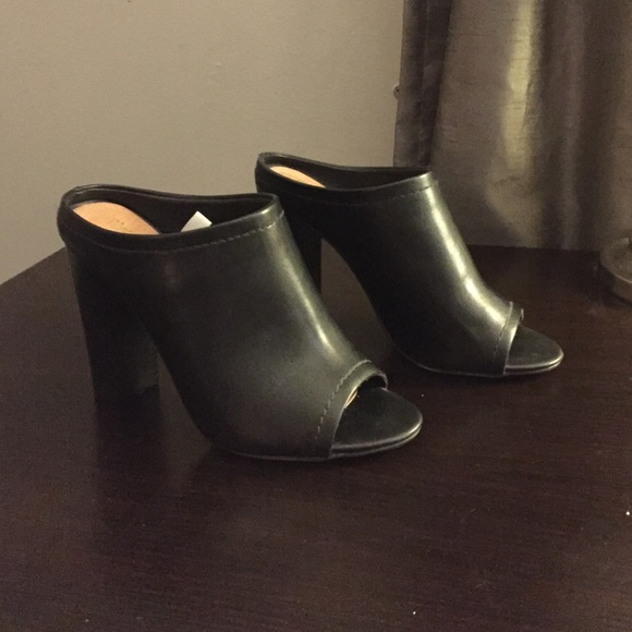 Black faux leather mules