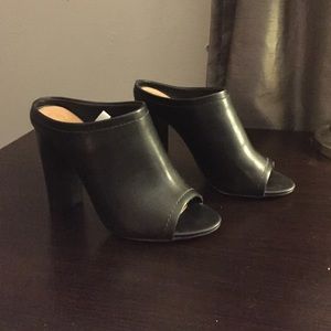 Black faux leather mules