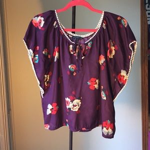 Floral/festive butterfly-style blouse.