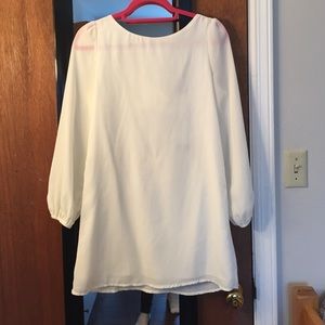 White long sleeve dress. Low back