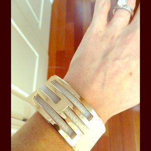 White faux leather and designer buckle bracelet