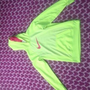 a neon yellowish greenish Nike sweatshirt