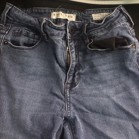 High waisted, dark blue jeans