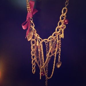 Gold and purple dangly necklace.