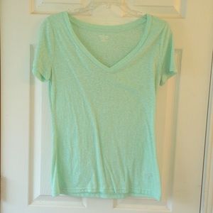 Teal green short sleeve top.