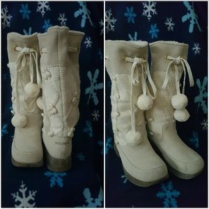 Ladies ivory colored boots.