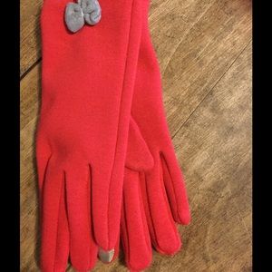 Red touchscreen gloves with a gray bow.