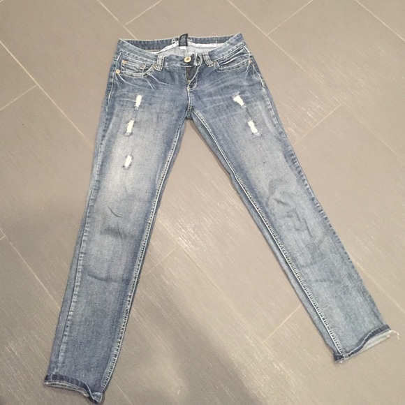 Cropped distressed blue jeans