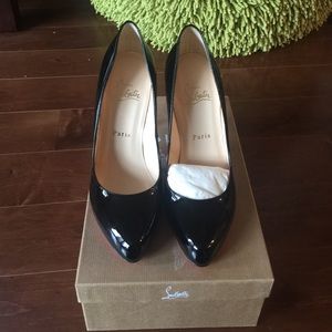 Black patent leather Louboutin heels