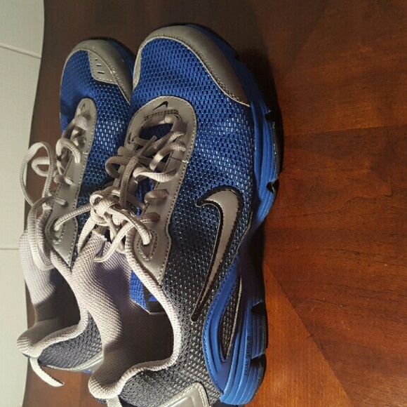 Silver and blue nikes.