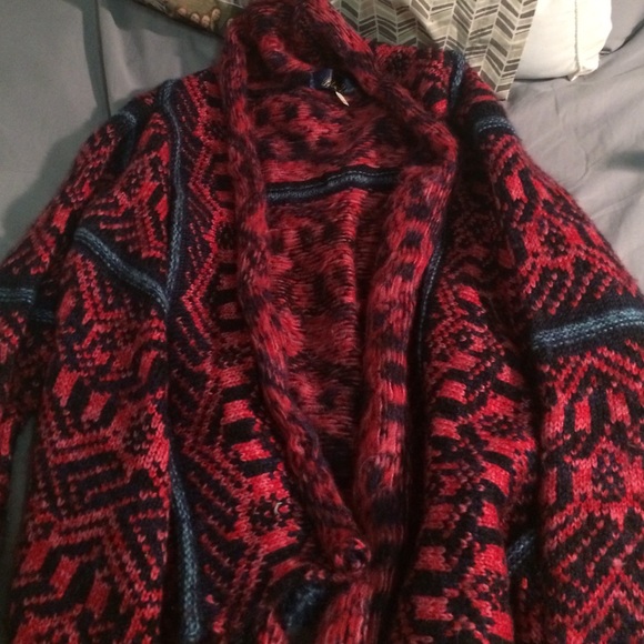 Loose, open cardigan. Heavy.