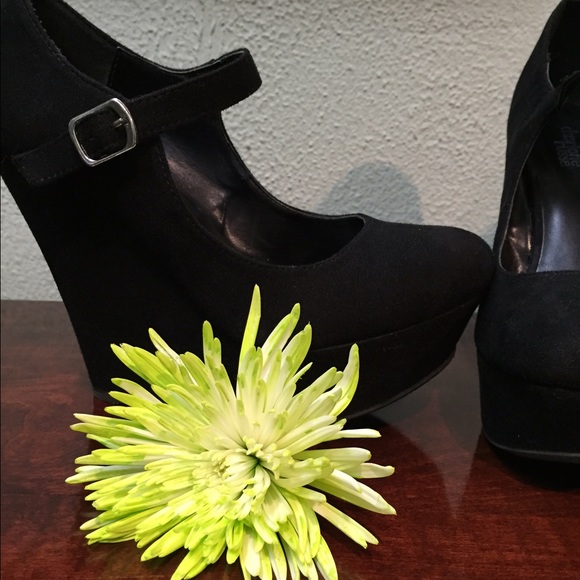 Black wedges with strap.