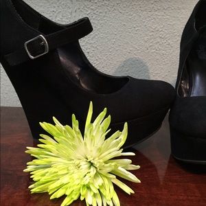 Black wedges with strap.