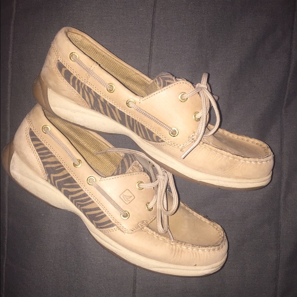 Sperry boat shoes with leopard pattern.