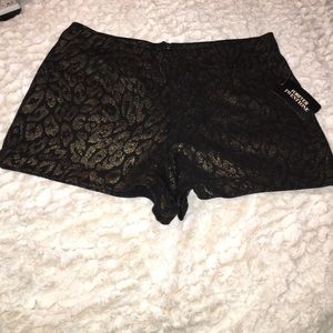 Never worn shorts with a zipper in the back.