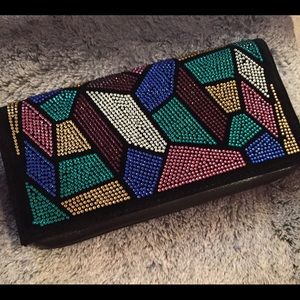 Black clutch with multicolored stones