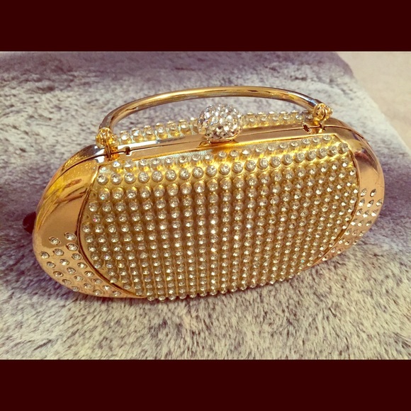 Gold clutch with stones