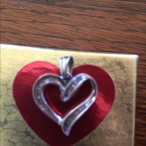 Heart shaped charm with diamonds