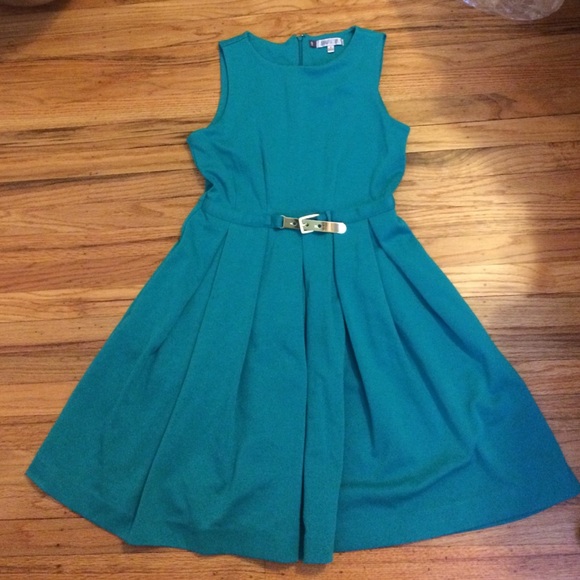 Jennifer Lopez fit and flair dress with gold belt