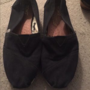 Toms black slip ons