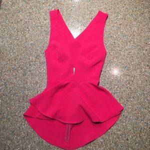 Pink peplum top, crosses in back