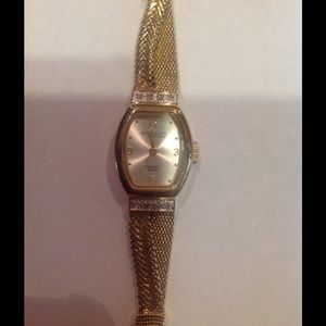 Women's Anne Klein gold and crystal watch.