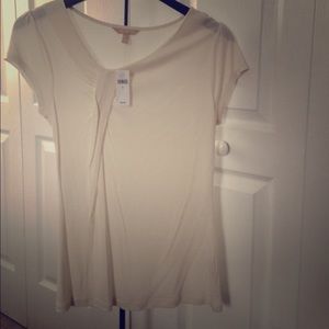 Short sleeves blouse, bias drape front detail.