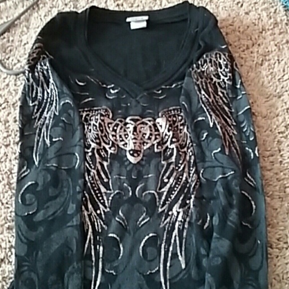 Long sleeve with wings on arm.daytrip1/2 off today