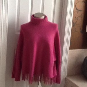 100% cashmere pink poncho with fringe bias.