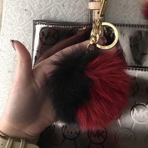 Black and red Michael kors fluff ball