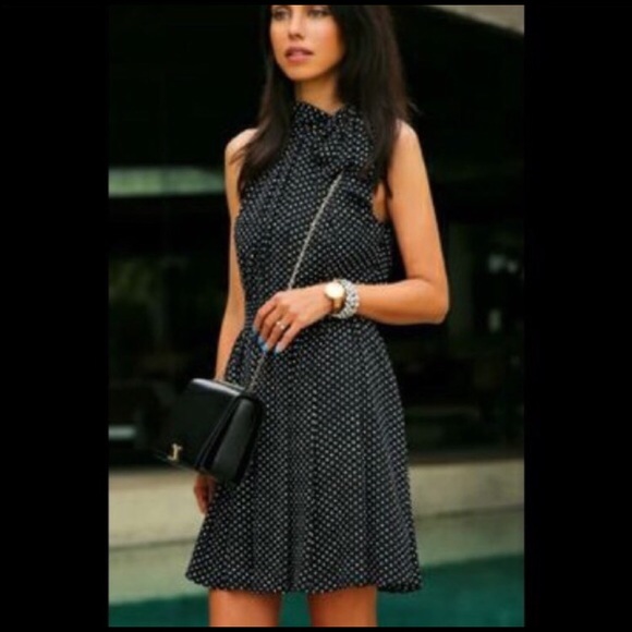 Polka dot dress with a tied neck