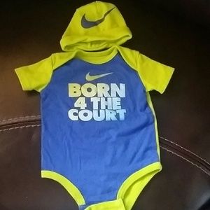 2 Nike baby onsies with matching beanies.