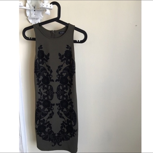 Green mini dress with black velvet detail. Size M