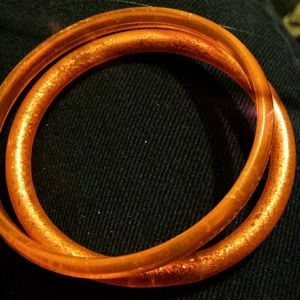 2 orange bracletes
