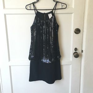 Little black dress with sequins.