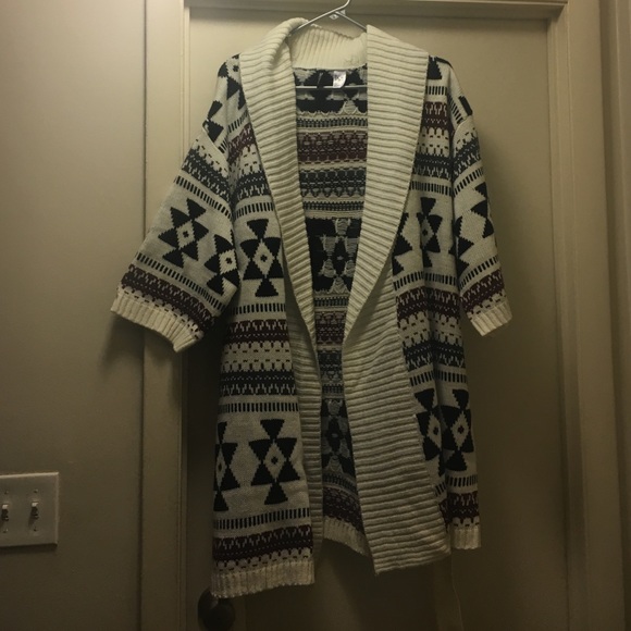 Never been worn. Beautiful sweater ties at waist