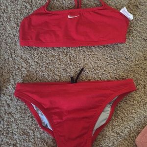red Nike swim suit