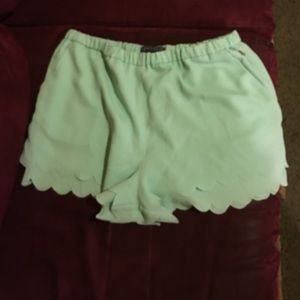 Scalloped bottom mint green shorts
