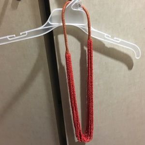 Red long statement necklace