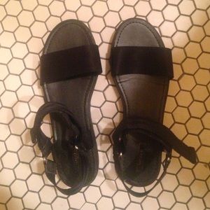 Velcro black sandals.