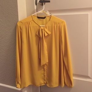 Dark yellow blouse with detailed front