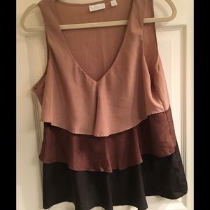 Beautiful ruffled sleeveless blouse.