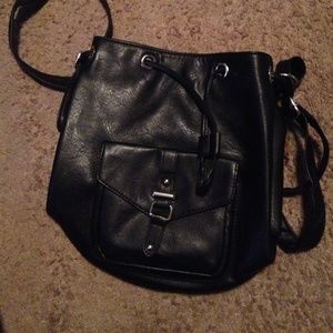 Adjustable black faux leather backpack