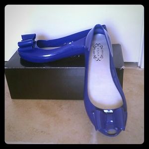 Royal blue flat shoes.